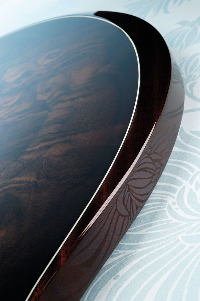 The Custom features a walnut burl veneered top